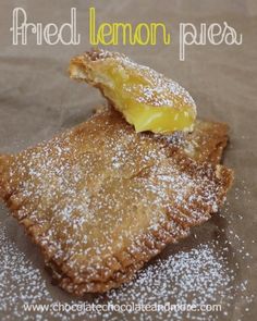 two pastries with powdered sugar on them and the words fried lemon pies