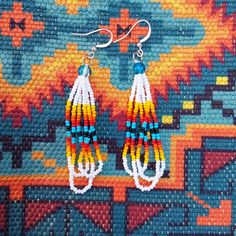 New, Hand Made By Me. White Seed Bead Triple Layered Native American Earrings. Made With Size 11/0 Czech Seed Beads And Blue Crackle Beads, On A Hypoallergenic Wire. Delica Beaded Earrings Native, Beaded Earrings Patterns Native American, Southwestern Style Large White Beads, White Southwestern Beaded Earrings For Festivals, Southwestern White Beaded Earrings For Festival, White Southwestern Style Beaded Earrings For Festival, Southwestern Style White Jewelry With Dangling Beads, Southwestern White Beads For Gift, Southwestern Style White Beads For Gift