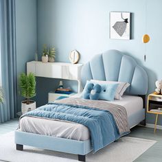 a bedroom with blue walls and white furniture