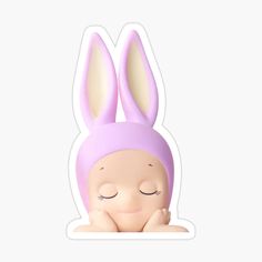 a sticker with an image of a bunny wearing a pink hat and sleeping on it's back