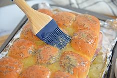 a spatula is being used to brush the bread