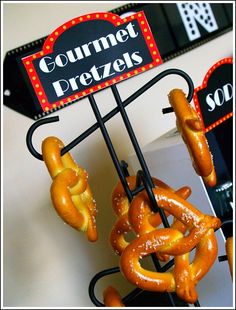 some pretzels are hanging from a sign that says gourmet dreizers