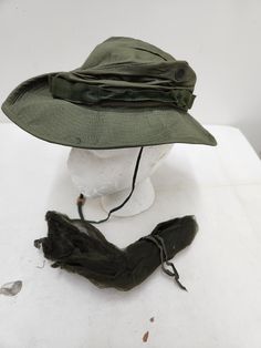 Vintage Military Issued Vietnam Era OD Green Boonie Hat with Insect Net Size-6 3/8 Condition-NEW NSN# 8415-935-2885 Dated-1969 Made in the USA! check us out at www.armysurpluswarehouselexington.com Green Military Brimmed Hat, Green Military Hat With Wide Brim, Green Military Style Wide Brim Hat, Green Wide Brim Military Hat, Boonie Hat, Insect Netting, Vintage Military, Insects, Vietnam