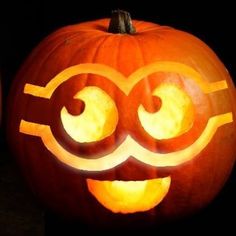 a carved pumpkin with the letter c on it's face and eyes drawn onto it