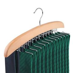 a green suit hanger with six rows of shirts hanging on it's hooks