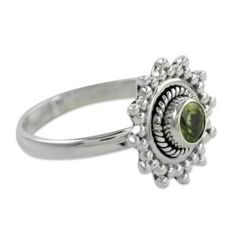 Peridot's cool green tones evoke sparkling lime green ice. Peridot represents August??s birthstone. By Neeru Goel this sterling silver ring design is enchantingly feminine. .925 Sterling silver Peridot Solitaire Jewelry For May Birthstone, Silver Peridot Birthstone Ring With Accent Stones, Silver Birthstone Ring With Peridot And Accent Stones, Peridot Center Stone Jewelry For May Birthstone, Lime Green Peridot Jewelry With Center Stone, Green Sterling Silver Stackable Rings For May Birthstone, Green Gemstone Sterling Silver Birthstone Ring, Lime Green Sterling Silver Birthstone Rings, Silver Peridot Rings For Promise