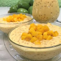 two bowls filled with food sitting on top of a table