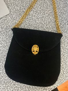 "Vintage Prestige evening bag Black  Gold tone embellished clasp Gold tone chain Includes a mirror and comb inside Zipper pocket Adjustable strap, can double the chain - extends to a drop of 12\" Approx 6\" tall x 5.5\" across" Formal Clutch Shoulder Bag With Chain Detail, Formal Clutch Shoulder Bag With Chain, Formal Rectangular Shoulder Bag With Chain, Formal Clutch Shoulder Bag With Gold Chain, Classic Formal Shoulder Bag With Gold Chain, Elegant Bags With Gold-tone Hardware For Gala, Elegant Rectangular Bag With Gold Clasp, Elegant Rectangular Bags With Gold Clasp, Elegant Evening Bags With Gold Chain