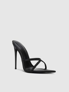 The Donatella Mule features a sleek criss-cross design with minimal straps and a slip-on detail. Its signature spiked stiletto heel adds a touch of edginess and makes it a versatile choice for both day and night wear. Satin upper Vegan insole Vegan outsole Open pointed toe Slip-on Handmade Designed in LA Self-covered stiletto heel, 4.75" (120mm) Chic Sandals With Cross Strap For Night Out, Chic Cross Strap Sandals For Night Out, Evening Heels With Cross Straps, Chic Heels With Crisscross Straps For Party, Elegant Cross Strap Sandals For Night Out, Evening Cross Strap Heels, Chic Party Heels With Crisscross Straps, Elegant Heels With Padded Heel And Cross Strap, Chic Cross Strap Heels For Formal Occasions