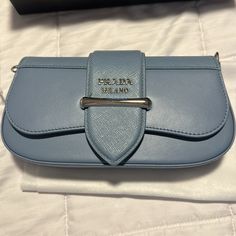 New Never Used Prada Mini Bandoliera In A Beautiful Light Blue Leather Comes With Removable Strap Bought At Bergdorfs And Never Used. I No Longer Have The Receipt But All Boxes And Packaging Are Intact Prada Cahier Bag, Prada Clutch, Prada Mini, Prada Candy, Leather Trifold Wallet, Prada Shoulder Bag, Prada Bags, Prada Leather, Leather Hobo Bag