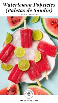 watermelon popsicles on a plate with limes