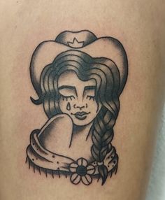 a woman's thigh with a heart shaped tattoo on it