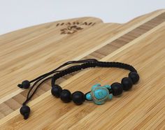 "Sea Turtle Bracelet. Black Bracelet. Unisex Design. Handmade Design with turquoise color sea turtle bead, black ball shape beads, black cord braided macrame style. Adjustable to fits most sizes! Pull the cord to adjust from 6\" inches up to 11\" inches. Handmade Design. Unisex. FAST SHIPPING! Visit my Etsy Shop to see more Designs Inspired in Turtles! Handmade Turtle Bracelets, Turtle Necklaces and Turtle Earrings. To visit my Etsy Shop Click here: https://www.etsy.com/shop/FreedomLifeStyle" Adjustable Turquoise Wristband Gift, Hawaiian Bracelets, Hawaiian Sea Turtle, Sea Turtle Bracelet, Turtle Gifts, Turtle Bracelet, Turtle Jewelry, Beach Bracelets, Turtle Necklace