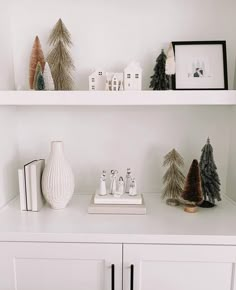 white shelves with christmas trees and ornaments on them