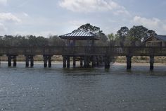 a wooden pier sitting on top of a lake