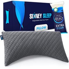 the pillow is next to an extra foam pad on it's side and in front of its packaging