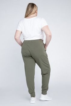 Elevate your comfort and style with our Plus-Size Jogger Pants. Crafted to provide the perfect blend of relaxation and fashion, these joggers are designed for a flattering and comfortable fit. With a relaxed silhouette and adjustable waistband, you can enjoy a customizable and snug feel. The jogger pants also feature functional side pockets, making them practical for everyday wear. Model is wearing a 1XModel SpecsHeight: 5'8"Bust: 40G Waist: 38.5"Hips: 49"Made in Cambodia Style: Casual Print / P Casual Ankle-length Joggers With Elastic Side Panels, Relaxed Fit Ankle-length Joggers With Side Pockets, Stretch Joggers With Elastic Side Panels, Ankle-length, Relaxed Fit Full-length Joggers With Side Pockets, Sportswear 4-way Stretch Joggers With Side Pockets, Plus Size Joggers, Adjustable Waistband, Jogger Pants, Cambodia