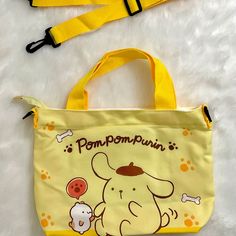 Shipping Is $5.95 Only. Super Cute Yellow Pompompurin Hand/Shoulder/Body Bag With Zipper Brand New Without Tag Yellow Pompompurin With Friend And Pawprints Design In Front Same Design On Both Sides Has Zipper Has One Side Pocket Inside Comes With Yellow Detachable And Adjustable Strap Can Be Used As A Shoulder Bag, Handbag Or Messenger Bag Approx. 12 In.W X 8.75 In. H Approx. 12 In. W X 12 ½ In. With Hand Handles Attachable Strap Can Be Adjusted Up To Is 41.75 Inches Long (Approx. 12 In. W X 30 Cute Yellow Crossbody Bag, Cute Yellow Bag With Adjustable Strap, Cute Yellow Bags With Adjustable Strap, Playful Yellow Shoulder Bag For Daily Use, Yellow Kawaii Travel Bag, Playful Yellow Shoulder Bag For School, Yellow Kawaii Style Travel Bags, Kawaii Yellow Travel Bag, Yellow Kawaii School Bag