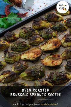 roasted brussel sprouts on a baking sheet with text overlay that reads oven roasted brussel sprouts recipe we bring recipes from world cuisine