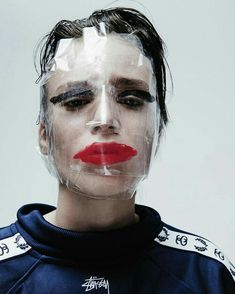 a woman with plastic covering her face and nose is shown in front of a white background