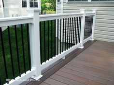 a close up of a white railing on a deck