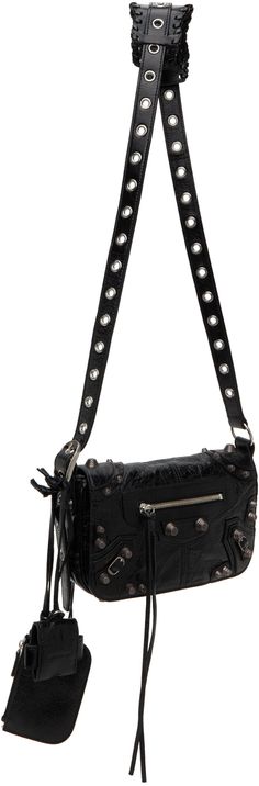 Crinkled Arena lambskin shoulder bag in black. · Pin-buckle shoulder strap · Detachable zip pouch at shoulder strap · Detachable mirror at shoulder strap · Studs and pin-buckle straps at face · Zip pocket at face and back face · Bumper studs at base · Foldover flap · Magnetic closure · Zip pocket at interior · Cotton canvas lining · Antiqued silver-tone hardware · H5.25 x W9.5 x D1.5 in Supplier color: Black Balenciaga Clothing, Airpods Pro Case, Heeled Rain Boots, High Heel Rain Boots, Balenciaga Black, Balenciaga Mens, Balenciaga Bag, Backpack Tote Bag, Boot Accessories