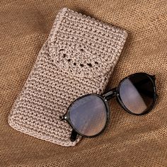 Safeguard your eyewear with a touch of artisanal elegance using this exquisite crocheted glasses case, which marries form and function in perfect harmony. The intricate pattern, meticulously crocheted from acrylic yarns by skilled Armenian artisan Manush Nersisyan, transforms an everyday item into a work of art. Handcrafted in a sophisticated beige shade, its compact design ensures it fits seamlessly into any bag, providing reliable protection against scratches. Whether you're treating yourself or surprising a loved one, this practical accessory offers a unique blend of traditional craftsmanship and contemporary style that's sure to impress. Beige Handbags, Mens Jewelry Necklace, African Masks, Perfect Harmony, Premium Gift, Mesh Bag, Everyday Items