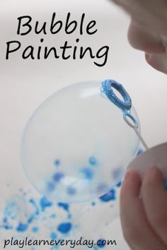 a child blowing bubbles with the words bubble painting