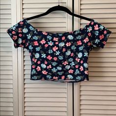 Nwt Off The Shoulder Crop Top Strappy Detailing On The Back Navy Base With Light Blue And Pink Flowers Size Small Top-Rated Seller! All Items Ship Next Day! All Reasonable Offers Considered. 15% Discount On Bundles! Feel Free To Ask Me Any Questions(: Happy Poshing! Blue Floral Print Stretch Top, Vacation Crop Top With Floral Print And Stretch Fit, Floral Print Stretch Crop Top For Vacation, Stretch Floral Print Crop Top For Vacation, Casual Blue Printed Crop Top, Casual Stretch Crop Top With Floral Print, Fitted Blue Printed Crop Top, Blue Floral Print Summer Crop Top, Navy Base