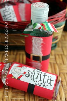 an empty bottle with santa's letter on it next to some candy canes