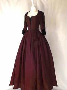 Step back in time with our stunning LOUISE, 18th-Century Dress in Burgundy Linen. This one-of-a-kind piece is inspired by the late 18th-century fashion, perfect for portraying iconic figures like Marie Antoinette, Elizabeth Swann, or Claire Fraser from Outlander. The square neckline closes at the front with a band of eyelets, and the preformed elbow sleeves are trimmed with a delicate lace ribbon, adding a touch of elegance to this historical masterpiece.Our LOUISE, 18th-Century Dress in Burgund Outlander Dress, Late 18th Century Fashion, Georgian Dress, 18th Century Dresses, English Dress, Elizabeth Swann, Popular Costumes, 18th Century Dress, Blue Outfits