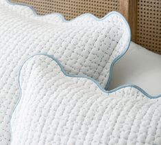 a close up view of a pillow on a bed