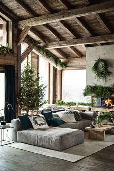 a living room filled with furniture and a fire place in the middle of it's walls