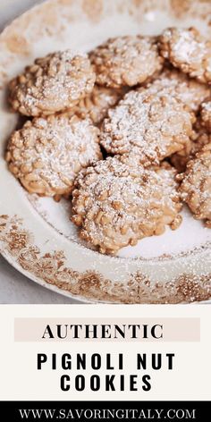 some cookies are on a white plate with the words authentic pignut cookies above it