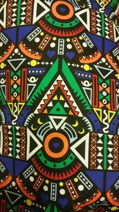 an african print fabric with colorful designs on it