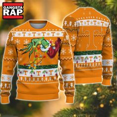 NCAA Tennessee Volunteers Grinch Hand Ugly Christmas Sweater Get ready to spread some holiday cheer with the NCAA Tennessee Volunteers Grinch Hand Ugly Christmas Sweater! This festive sweater perfectly blends the spirit of college football and the joy of the holiday season, making it a must-have for true fans and those looking to embrace the fun of ugly sweater parties. Featuring a playful Grinch hand design, this ugly Christmas sweater captures the whimsical essence of this beloved holiday char Grinch Christmas Lights, Grinch Hands, 3d Sweater, Christmas Ugly Sweater, Christmas Grinch, Holiday Attire, Funny Xmas, Clemson Tigers, Tennessee Volunteers