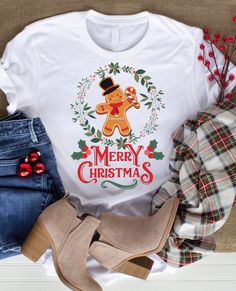 a t - shirt that says merry christmas with a teddy bear wearing a top hat