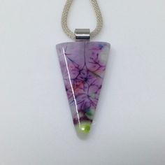 "This unique fused glass pendant has several shades of purple with hints of green and blue. It was made using a unique fusing technique which results in an abstract floral effect. Truly a stunning one of a kind piece of wearable art! This triangle shaped pendant measures 49mm (2\") long by 28mm (1 1/8\") wide and is mounted on a silver plated bail.  ** Included is a complimentary necklace of your choice. You can see the full descriptions of your choices in this section of my shop: https://www.et Lavender Art, Glass Pendent, Art Glass Jewelry, Glass Suncatchers, Fused Glass Earrings, Jewelry Purple, Stained Glass Suncatchers, Glass Fusion, Glass Jewellery