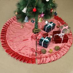 a christmas tree skirt with presents under it