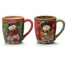 two coffee mugs with snowmen painted on the sides, one is red and one is green