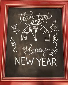 a chalk board with the words happy new year written on it