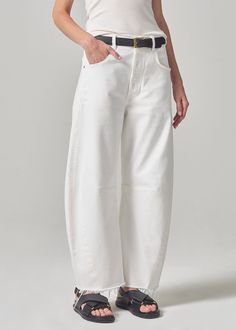 Aptly named, the Horseshoe jean is fashioned with a curved, wide leg that falls to slightly tapered and cropped, frayed hems. This oversized silhouette looks great with a sleek tank or tee. This fit is true to size. Looks Like: True, clean white with a raw frayed hemFeels Like: Non-stretch organic denim with a soft hand From our HUMANITY Collection Minimal Dress, Nye Outfits, Oversized Jeans, Mother Denim, Oversized Silhouette, Citizens Of Humanity, Wide Leg Denim, Ulla Johnson, Hat Hairstyles