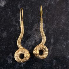 Gold Snake Drop Earrings, Gold Snake Earrings, brass Snake Earrings, Snake Dangle Earrings, Statement Snake Earrings, Snake Earrings METAL :- Brass ❥ Customers satisfaction is our biggest priority, please contact us with any questions/queries for future or existing orders, and we will do our best to make sure you are happy with your order. ♥ Please Make Sure to Include The Correct Address During Before Order. You Can return Item within 30 Days After Successful Delivery. We Offer 100% Money Back Guarantee If You Not Satisfied With Your Purchase. Return Charge Will Be Paid By Buyer Only. This is my shop link https://www.etsy.com/in-en/shop/AustereGifts?ref=seller-platform-mcnav Thank you🥰 for shopping with us! Antique Gold Brass Earrings With Ear Wire, Yellow Gold Brass Drop Earrings, Yellow Gold Brass Danglers, Bronze Brass Earrings With French Hook, Yellow Gold Brass Earrings With French Hook, Gold Snake Earrings, Earrings Snake, Drop Earrings Gold, Snake Earrings