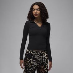 Soft, stretchy and oh-so comfortable. Made for everyday wear, this ribbed long-sleeve top gives you a confident, casual look with a body-skimming fit and V-neck design. Black Ribbed Long Sleeve Top For Spring, Fitted Black Ribbed Long Sleeve Top, Fitted Black Long Sleeve Top With Ribbed Detail, Fitted Black Long Sleeve Ribbed Top, Fitted V-neck Top With Ribbed Cuffs, Black Long Sleeve Top For Fall, Trendy Winter Tops In Elastane, Black Ribbed Long Sleeve Top For Winter, Fall Loungewear Tops In Elastane