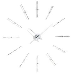 a clock made out of sticks on a white background