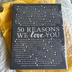 there is a book that says 50 reasons we love you on the front and back