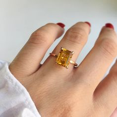 RING DETAILS: ✪Design: Gold ring ✪Gemstone: Natural yellow beryl, moissanite diamond ✪Gemstone shape: Emerald cut ✪Gemstone transparency: Transparent ✪Gemstone weight: Natural yellow beryl- 2.40 cts. ✪Setting type: Prong setting ✪Metal type: 14k solid gold ✪Gold weight: 1.81 gm ✪Metal finish: Smooth shiny ✪Total ring weight: 2.23 gm Choose your ring size from drop down menu and if you need any other preferred ring size please contact us. QUALITY OF MATERIALS: Metal: Most of our jewelry at Jewelr Yellow Topaz Promise Ring In 14k Gold, Gift Yellow Gold Radiant Cut Sapphire Ring, Citrine Promise Ring With Prong Setting, Citrine Prong Setting Promise Ring, Radiant Cut Sapphire Ring In Yellow Gold, Gold Sapphire Ring With Radiant Cut For Gift, Gold Radiant Cut Sapphire Ring Gift, Yellow 14k Gold Emerald Cut Rings, 14k Gold Yellow Solitaire Ring