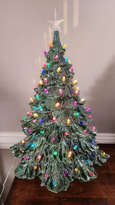 a small christmas tree with multicolored lights