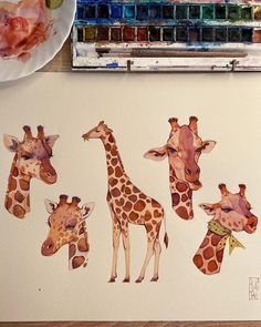 the giraffes are painted in watercolor on paper