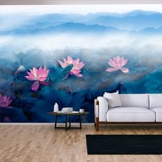 a living room with a couch, coffee table and painting on the wall